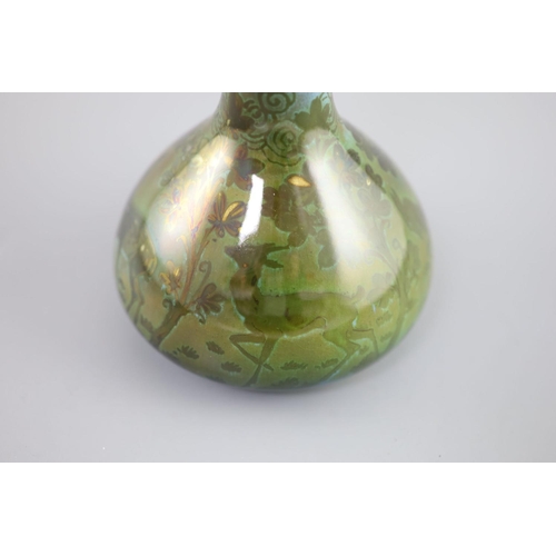 94 - Richard Joyce for Pilkington Royal Lancastrian. A lustre bottle vase, in green, yellow and blue tone... 