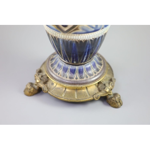 96 - A large Doulton Lambeth stoneware oil lamp, by Edith D. Lupton, dated 1880, decorated with cherub he... 