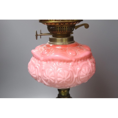 426 - A Victorian brass and pink glass oil lamp, height 70cm