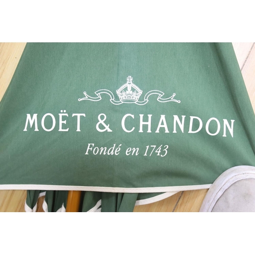 428 - A Moet & Chandon umbrella, length 96cm