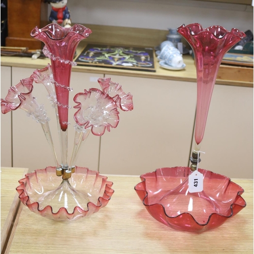 431 - A Victorian cranberry glass four branch epergnes and a single glass epergne, tallest 47cm