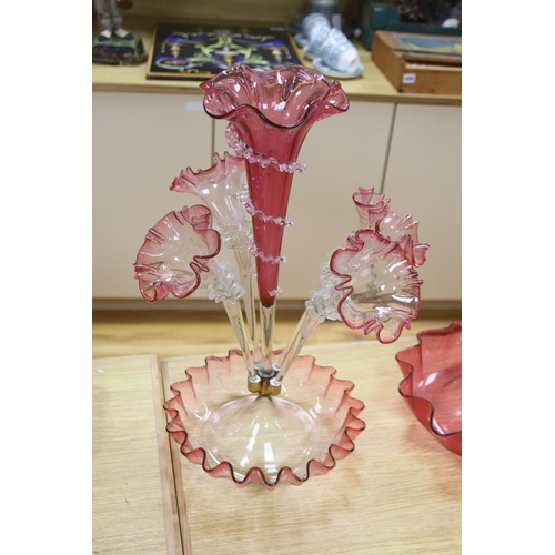 431 - A Victorian cranberry glass four branch epergnes and a single glass epergne, tallest 47cm