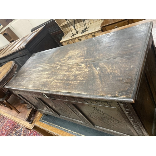 47 - An early 18th century panelled oak coffer, length 134cm, depth 54cm, height 63cm