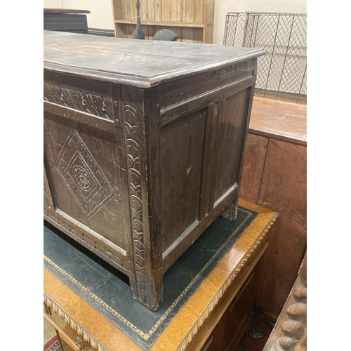 47 - An early 18th century panelled oak coffer, length 134cm, depth 54cm, height 63cm