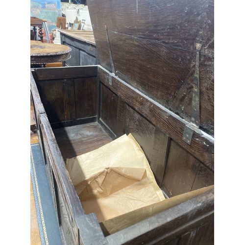 47 - An early 18th century panelled oak coffer, length 134cm, depth 54cm, height 63cm