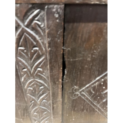 47 - An early 18th century panelled oak coffer, length 134cm, depth 54cm, height 63cm