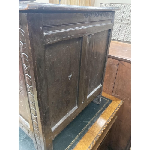 47 - An early 18th century panelled oak coffer, length 134cm, depth 54cm, height 63cm