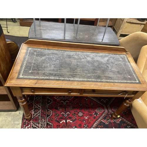 57 - A Victorian mahogany two drawer writing table, with a leather inset top, width 114cm, depth 52cm, he... 