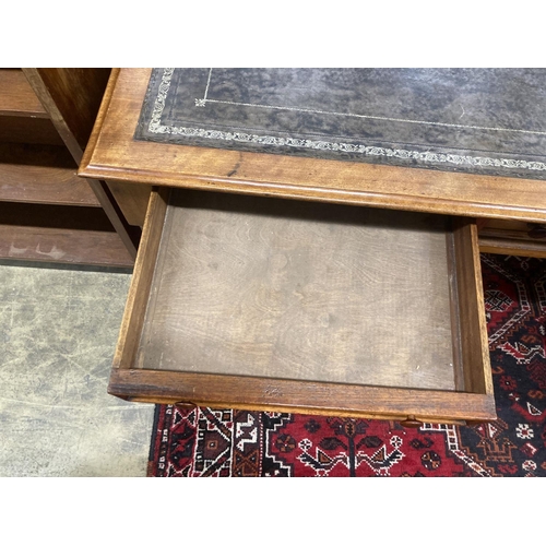 57 - A Victorian mahogany two drawer writing table, with a leather inset top, width 114cm, depth 52cm, he... 