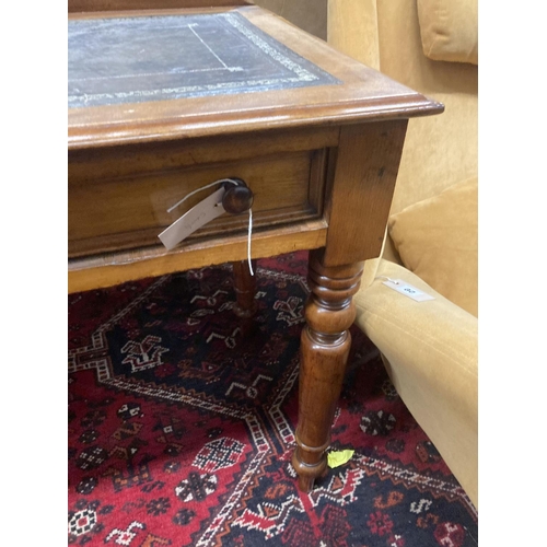 57 - A Victorian mahogany two drawer writing table, with a leather inset top, width 114cm, depth 52cm, he... 