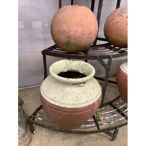 10 - Five assorted terracotta pots together with a wrought iron corner pot stand, height 75cm... 