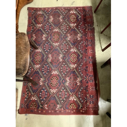 102 - A pair of Caucasian red ground rugs, 154 x 97cm