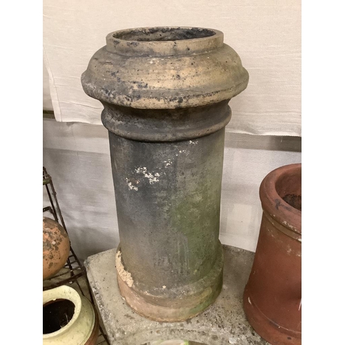 11 - Two pottery chimney pots, larger 76cm high