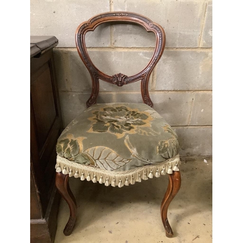 142 - A Victorian ebonised and gilt upholstered nursing chair and pair of balloon back chairs