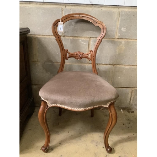 142 - A Victorian ebonised and gilt upholstered nursing chair and pair of balloon back chairs