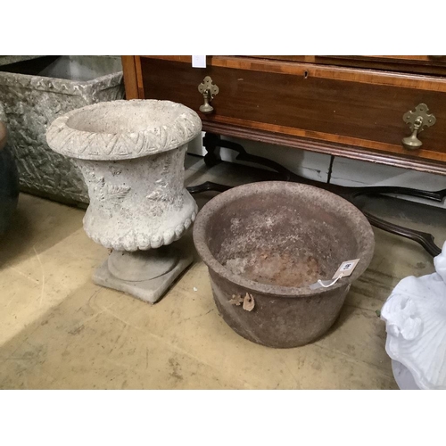 148 - A reconstituted stone planter, height 44cm on base together with a circular cast iron garden planter... 