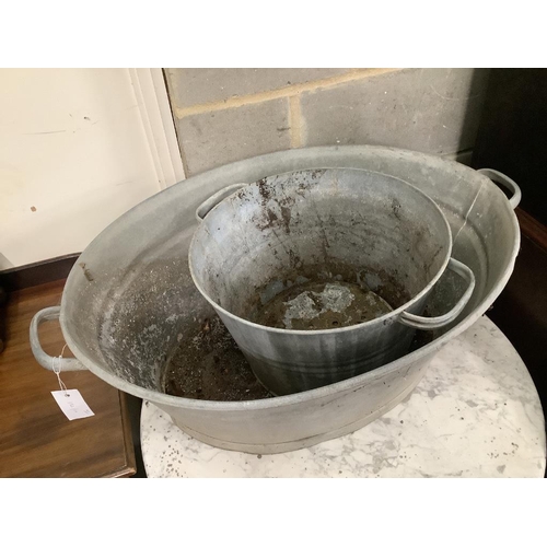 150 - Two galvanised tubs, larger width 80cm, together with four watering cans