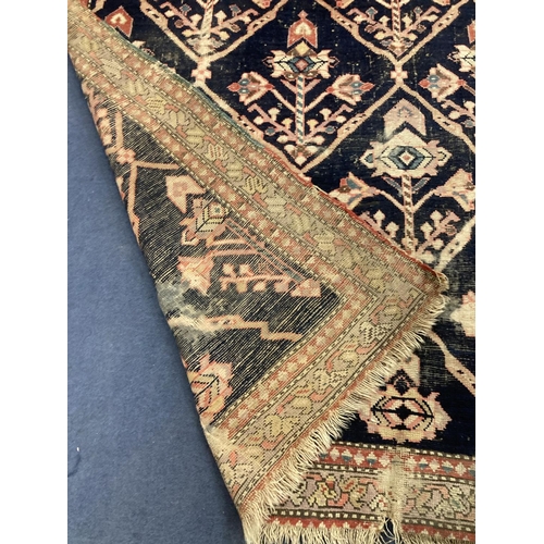 162 - A Caucasian blue ground rug, 230 x 124cm