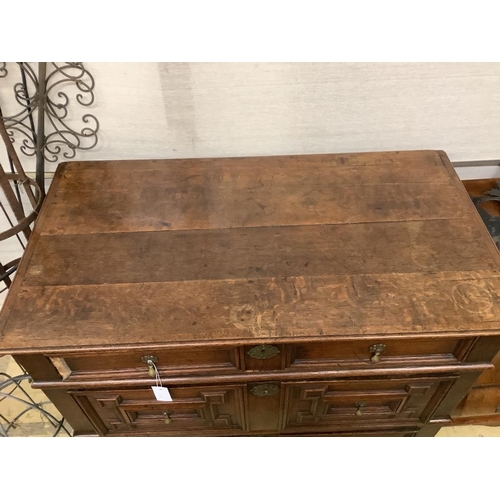 17 - An 18th century oak geometric moulded two part chest, width 105cm, depth 58cm, height 100cm... 