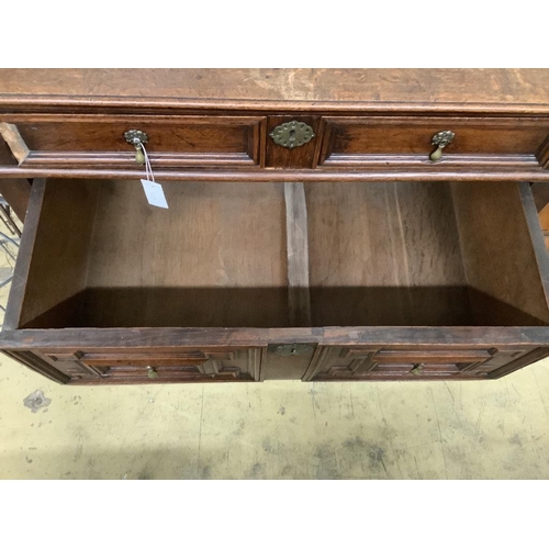 17 - An 18th century oak geometric moulded two part chest, width 105cm, depth 58cm, height 100cm... 