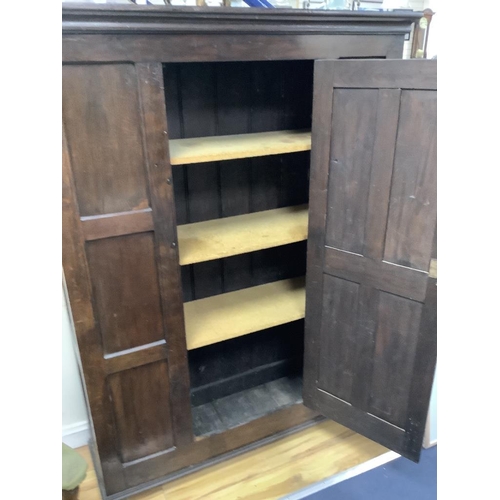 173 - An 18th century and later panelled oak cabinet, width 130cm, depth 40cm, height 173cm