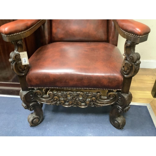 176 - A Carolean style carved walnut and burgundy leather wing armchair, width 72cm, depth 86cm, height 12... 