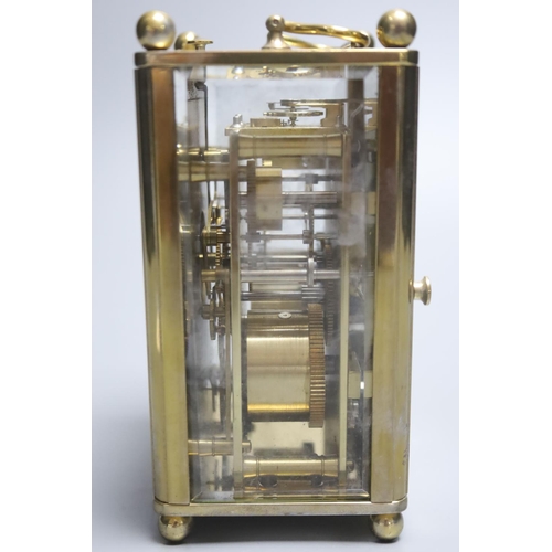 203 - A Charles Frodsham brass cased repeating carriage clock, height 14cm with handle down