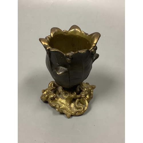 207 - A small bronze 'tulip head' vase with gilt 'dragon' base, height 9cm