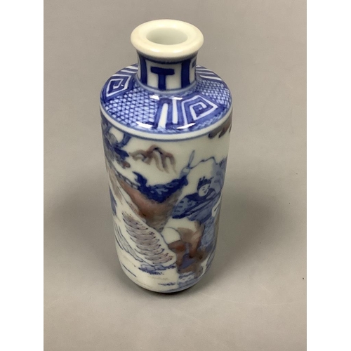 222 - A Chinese underglaze blue and copper red snuff bottle, height 11.5cm