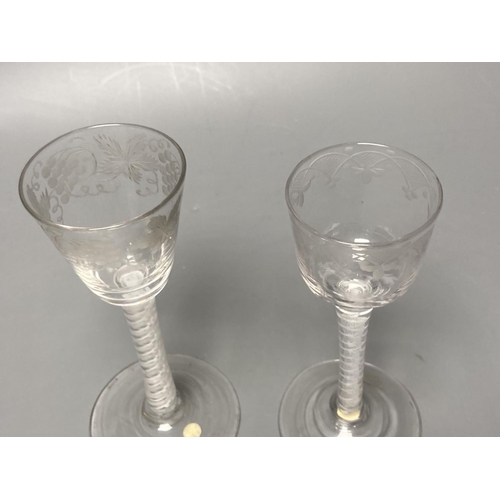 228 - Two George III double series opaque twist stem cordial glasses, c.1760-70, with wheel engraved funne... 