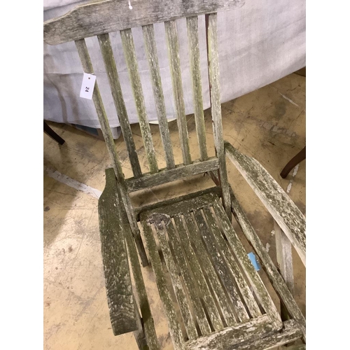 24 - A weathered teak folding garden steamer chair