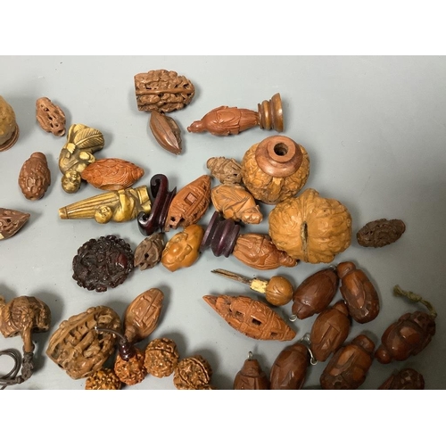 244 - An assortment of Chinese peach stone and a nut carvings