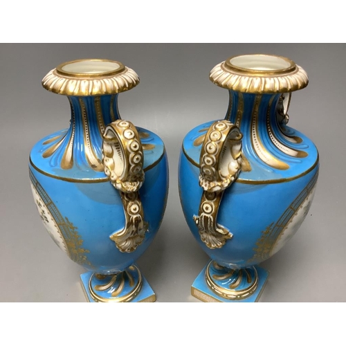 253 - A pair of mid 19th century Coalport turquoise ground two handled vases, painted in Sévres style with... 