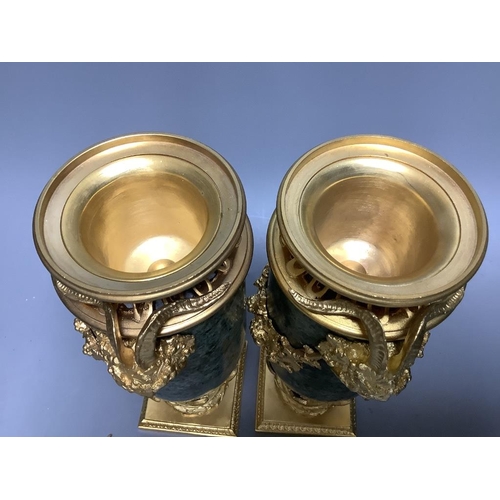 259 - A modern pair of gilt metal and marble urns32cm