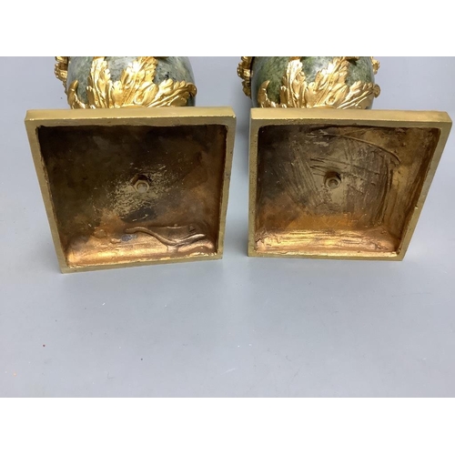 259 - A modern pair of gilt metal and marble urns32cm