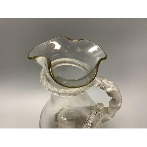 274 - A 19th century glass lemonade jug with snake handle and ice compartment, height 33cm