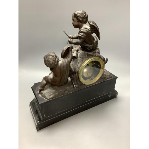 276 - An early 20th century French spelter and slate cherub mantel clock, height 34cm