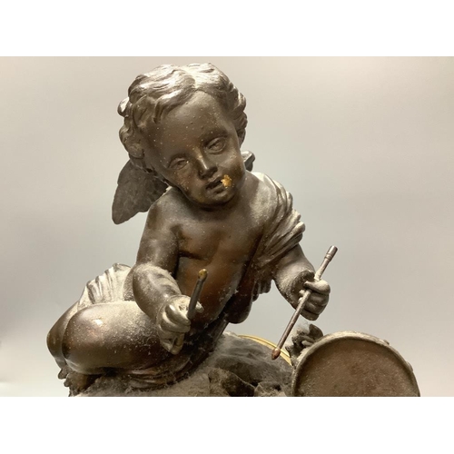 276 - An early 20th century French spelter and slate cherub mantel clock, height 34cm