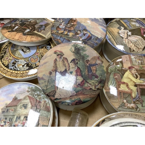 302 - A collection of Prattware pot lids and bases (approx 19)