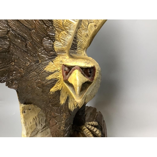 306 - A carved wood eagle, height 61cm