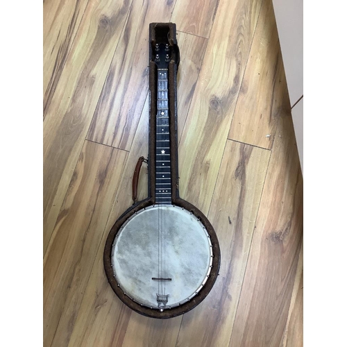 309 - A cased banjo, unmarked