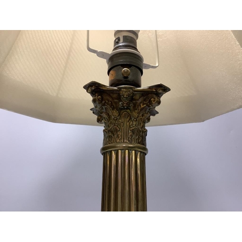 323 - A brass corinthian table lamp and an Edwardian inlaid mahogany letter rack