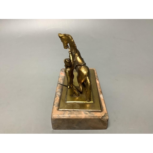 324 - An early 20th century gilt metal group of a horse and jockey, on marble base, length 13cm... 