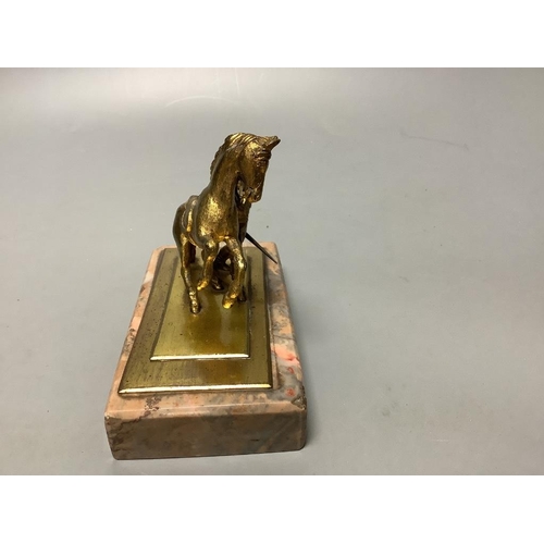 324 - An early 20th century gilt metal group of a horse and jockey, on marble base, length 13cm... 