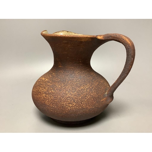 332 - Waistel Cooper (1921-2003). A pottery jug with textured glazed body, height 18cm