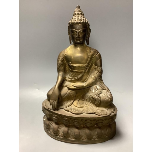 333 - A bronze figure of a seated Buddha and a Japanese blue and white ovoid vase, of 'sack' form with app... 