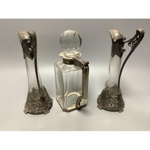 374 - A pair of WMF style pewter-mounted glass jugs and an electroplate mounted spirit decanter, tallest 2... 