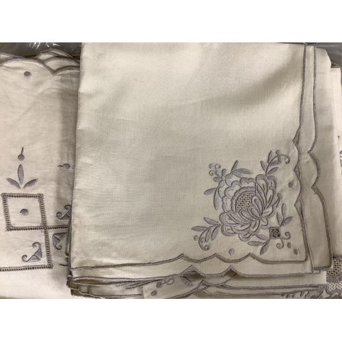 387 - A quantity of Chinese embroidered linen