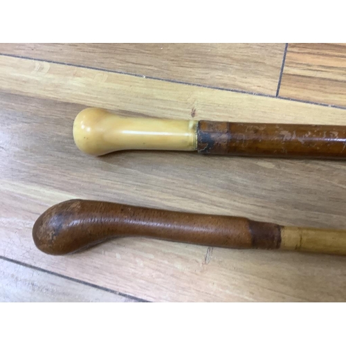 390 - Two walking sticks, one with marine ivory handle and a painted fan