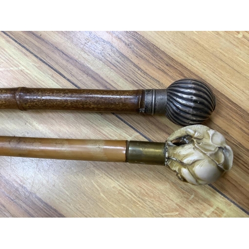 413 - A silver mounted cane and one other faux ivory cane, longest 92cm